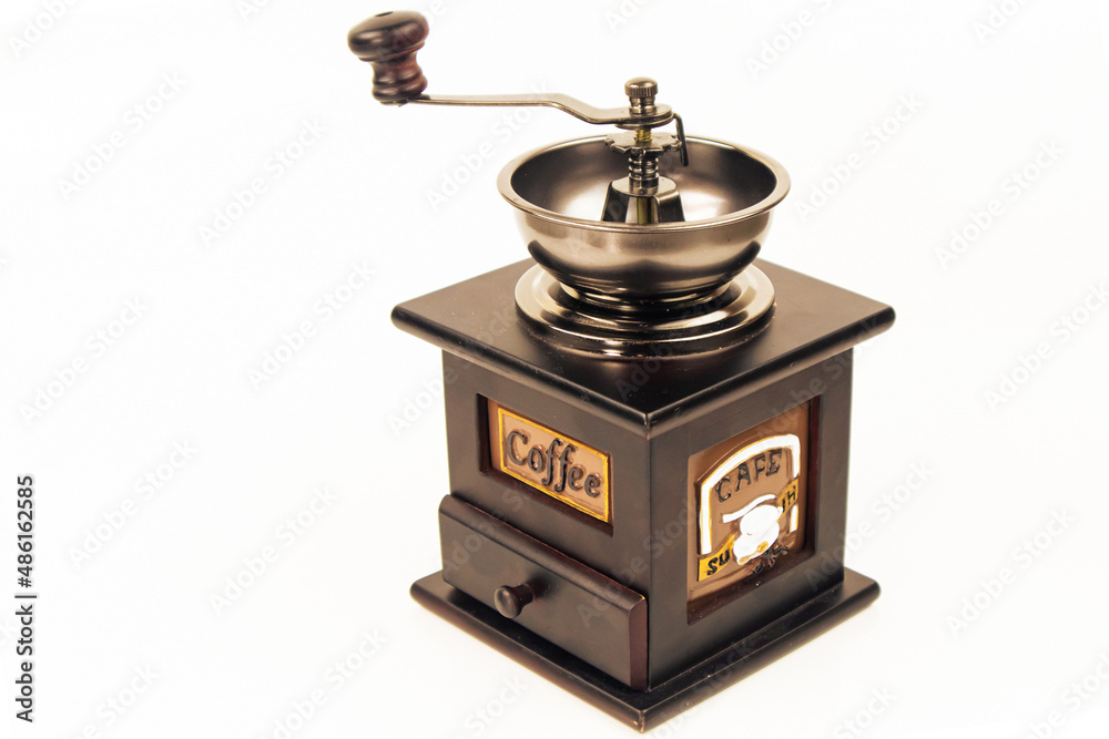 Coffee grinder on white background. Vintage coffee grinder for grinding coffee beans.