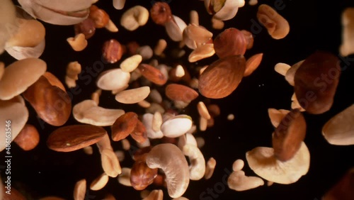 Super Slow Motion Closeup Shot of Falling Various Nuts Towards Camera on Black at 1000fps.