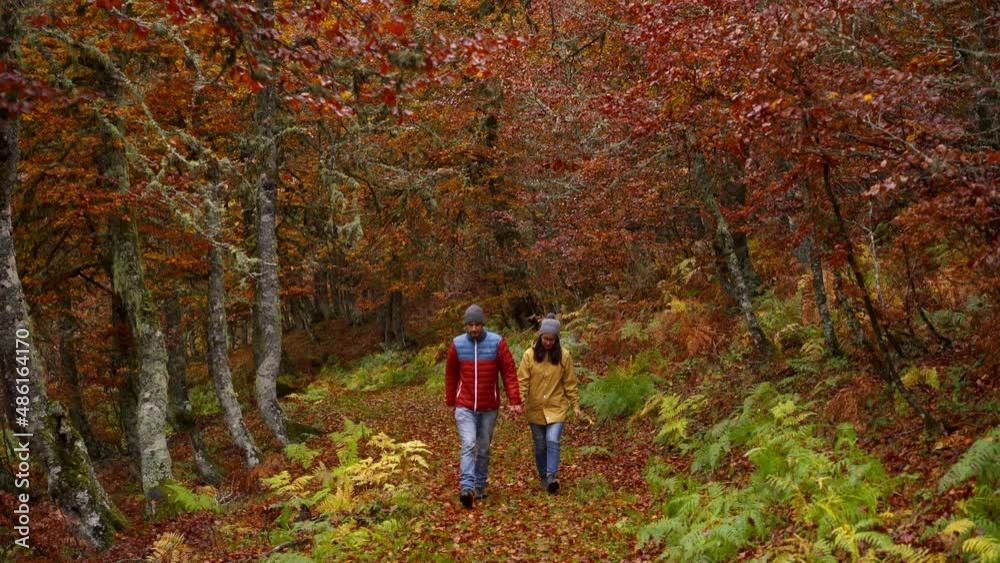 Young caucasian couple walking in Picos de Europa, Spain Young caucasian couple walking in Picos de Europa, Spain