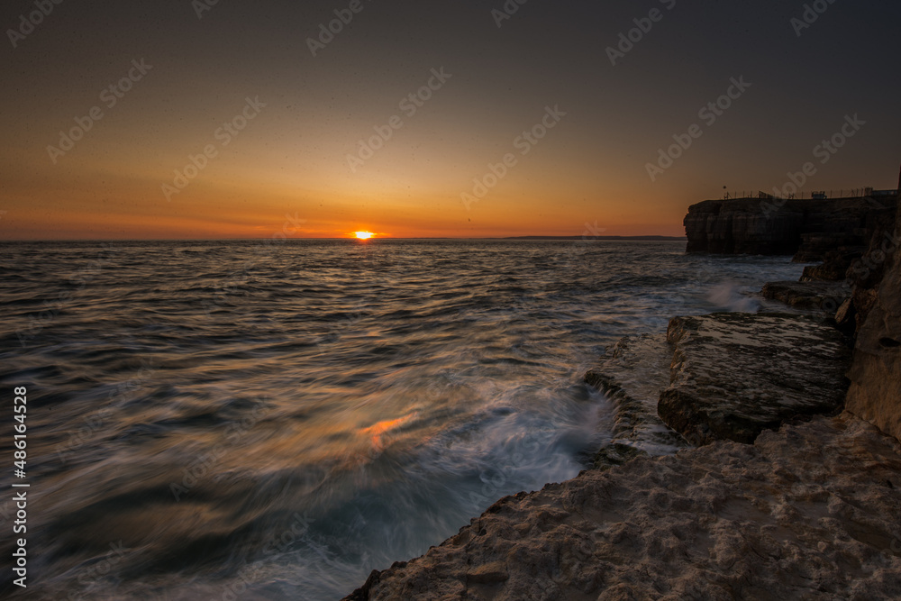 sunset over the sea dorset portland bill