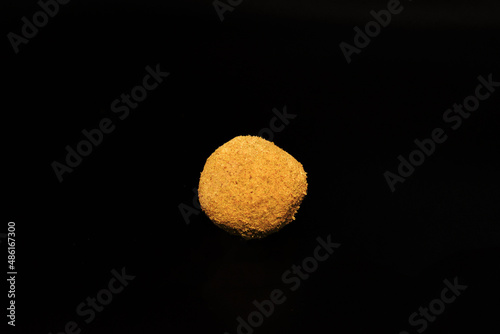 CBD hash rock single black background (Hurcann.com) photo