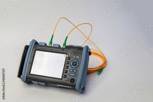 Professional testing of fiber optic connections OTDR meter. Measurement of the throughput of the optical fiber network. Expert work in the IT industry.