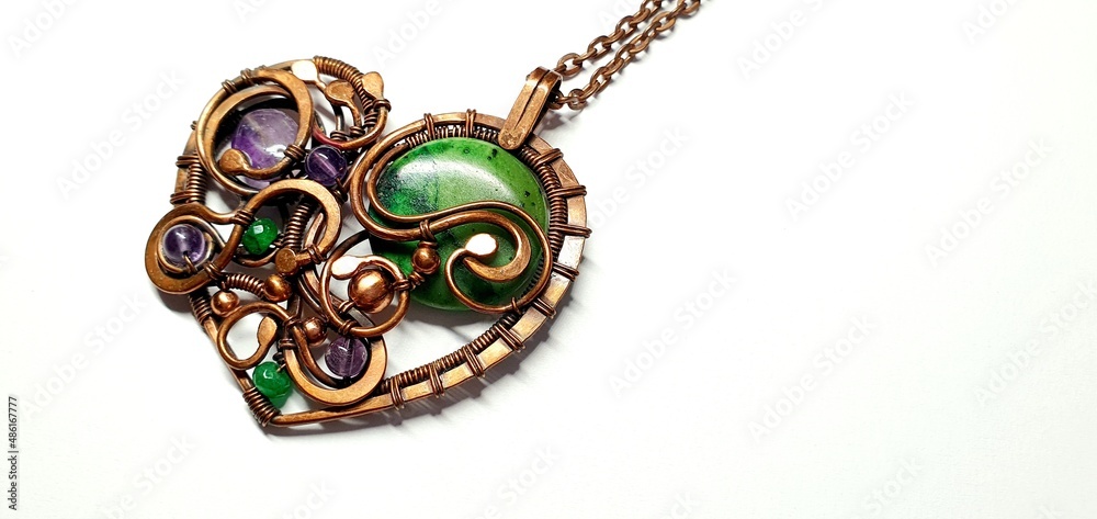 Beautiful jewelry heart. Gold pendant heart. Copper heart pendant with precious stones. Heart necklace. Beautiful jewelry heart. Gold pendant heart. Copper heart pendant with precious stones. Heart necklace.