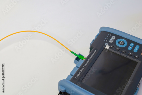Professional testing of fiber optic connections OTDR meter. Measurement of the throughput of the optical fiber network. Expert work in the IT industry.