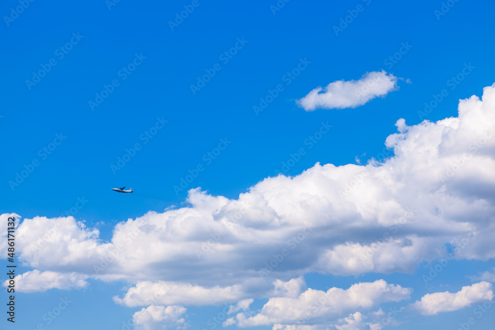 Plane in the clouds . Flight in blue sky 
