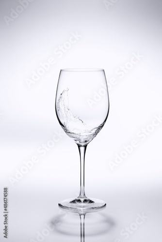 wine glass on white reflective background