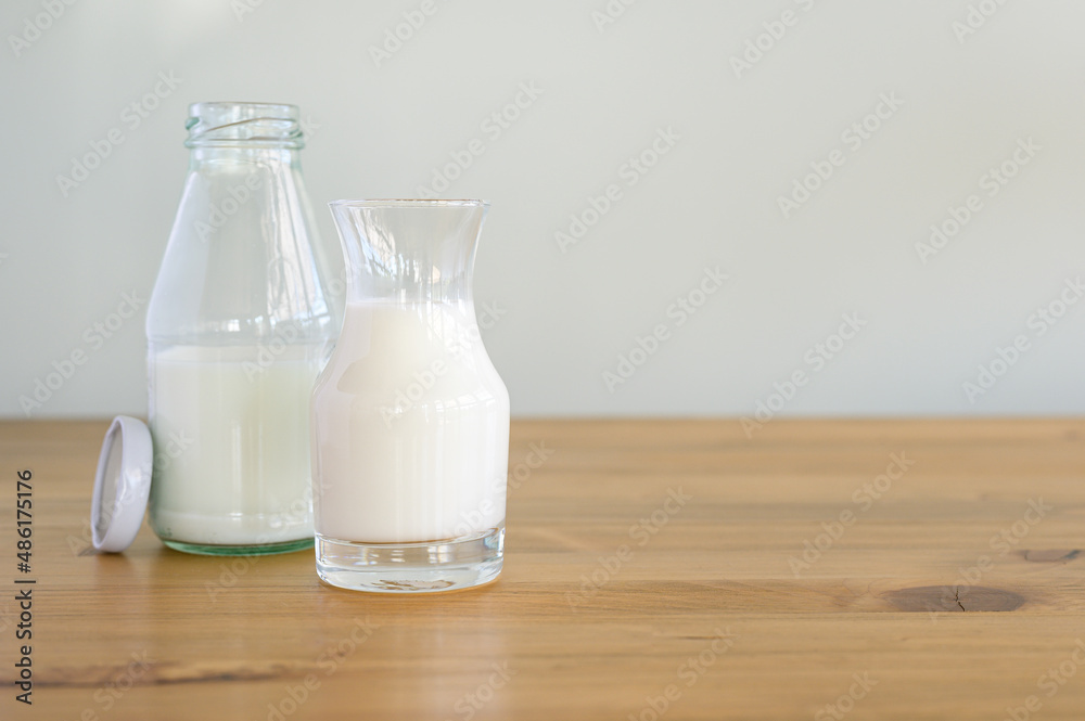 fresh milk in glass and Bottle on wooden table, healthy food and drink concept, Dairy products fresh milk in glass and Bottle on wooden table, healthy food and drink concept, Dairy products