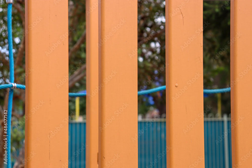 looking trhough bright yellow bars of playground looking trhough bright yellow bars of playground