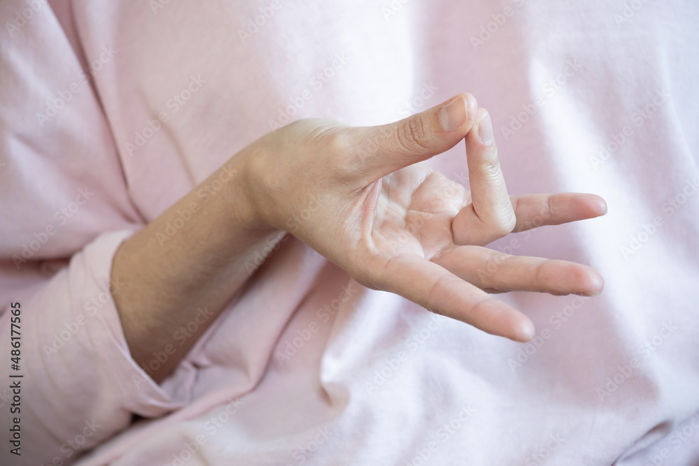 Naklejka premium Hand doing Prithvi mudra