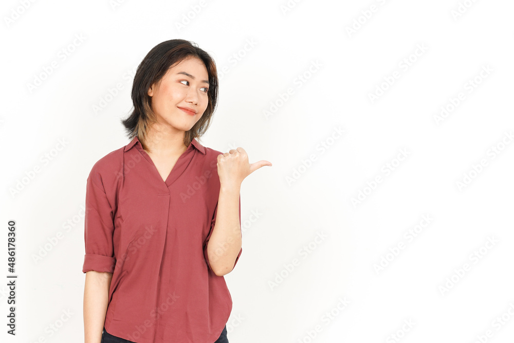 Showing and Pointing Side Product With Thumb Of Beautiful Asian Woman Isolated On White Background Showing and Pointing Side Product With Thumb Of Beautiful Asian Woman Isolated On White Background
