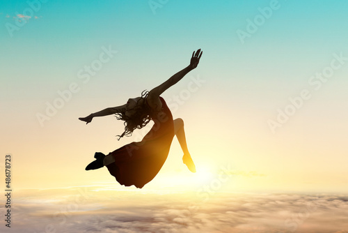 Female dancer against sunse...