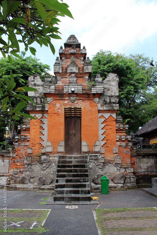 Brick gates and door of Pura Jagatnatha of Denpasar. Taken in January 2022.