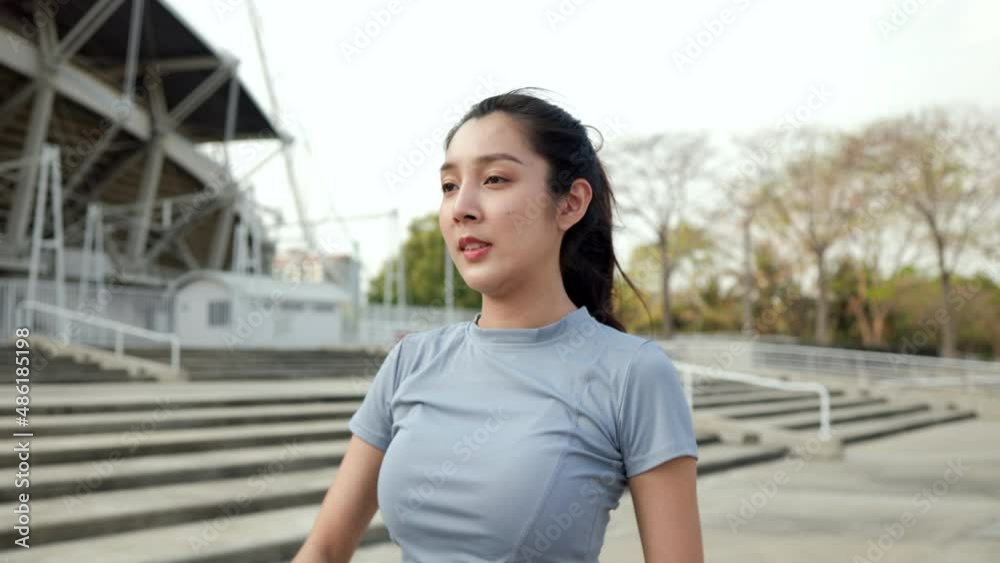 Slim beautiful woman wearing sportswear warming up in the city at sunrise. Confident and powerful woman stretching outdoor. Workout exercise in the morning. Healthy and active lifestyle concept. Slim beautiful woman wearing sportswear warming up in the city at sunrise. Confident and powerful woman stretching outdoor. Workout exercise in the morning. Healthy and active lifestyle concept.