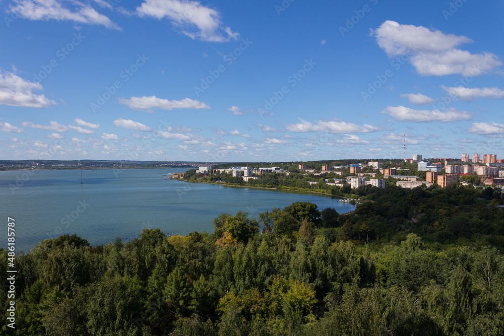 view from a height of a city pond, a green city, a beautiful summer landscape of a pond in a small town