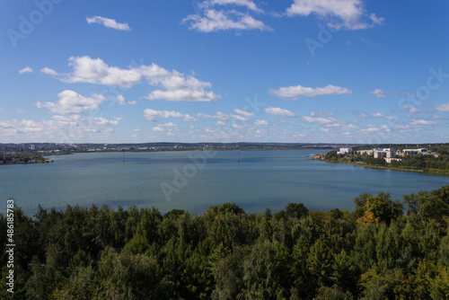 view from a height of a city pond, a green city, a beautiful summer landscape of a pond in a small town