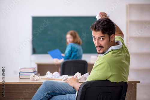 Two students having fun in the classroom © Elnur