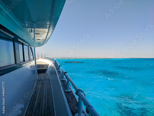 Beautiful view of the azure red sea from the deck of a large white yacht. Hurghada, Egypt. © lexosn