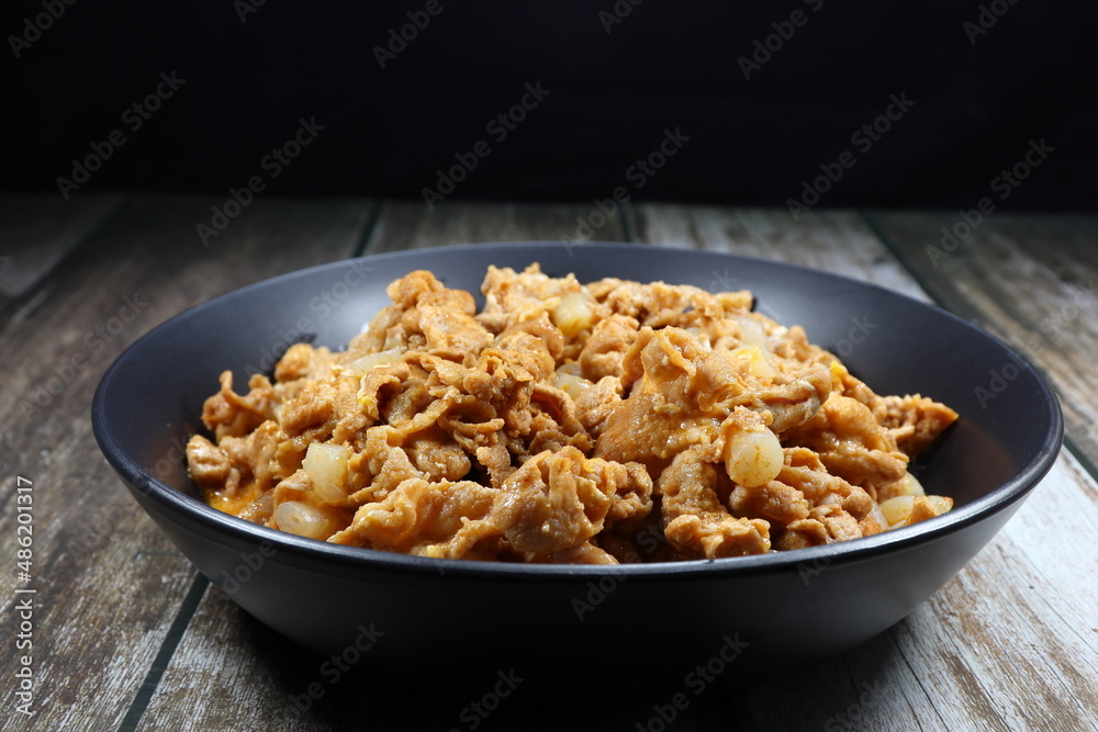 Traditional fried pork sliced with Gochujang (Korean sauce) serving on the plate. Famous comfortable food menu in Asia restaurant. Traditional fried pork sliced with Gochujang (Korean sauce) serving on the plate. Famous comfortable food menu in Asia restaurant.