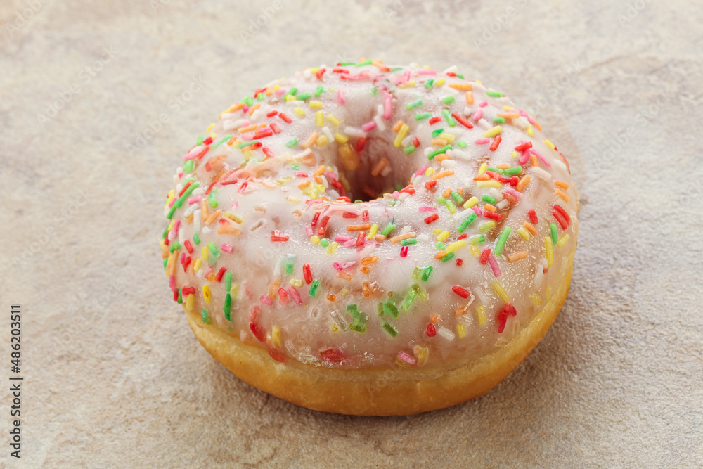 Sweet glazed vanilla donut with icing