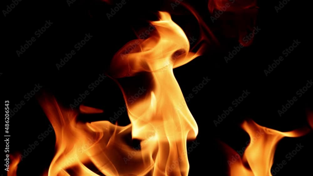 video with orange flame isolated on black background. Fire bright sparks slow motion