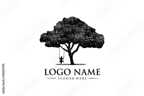little boy playing on swing under tree, grunge rustic vintage logo design.