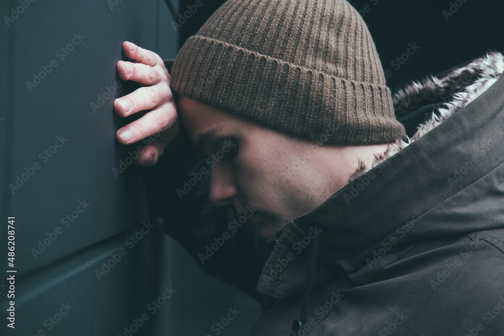 street portrait of a sad upset teenager