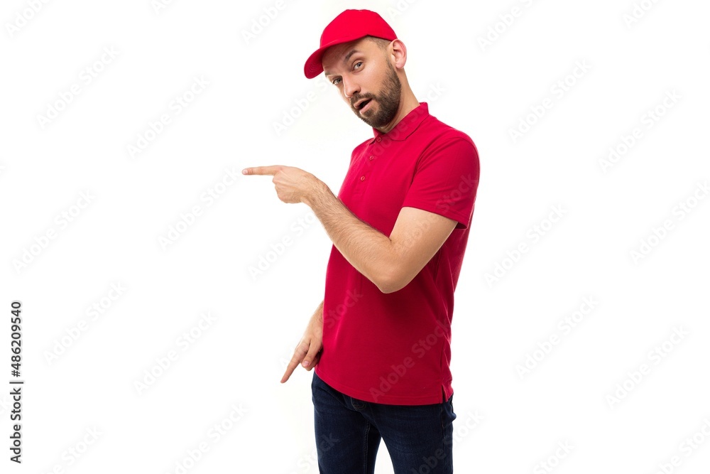 delivery courier in red uniform shows left and down with fingers delivery courier in red uniform shows left and down with fingers