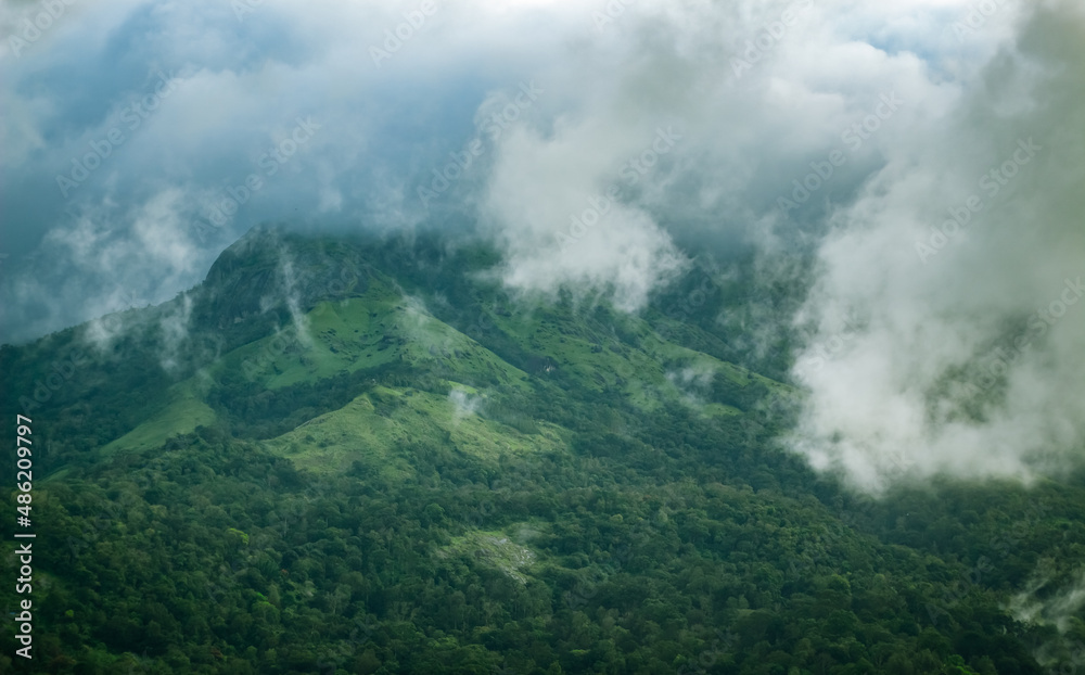 Beautiful Western Ghats Green mountain landscape with passing clouds. Munnar, Kerala, India