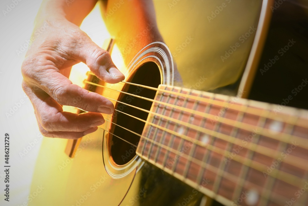 Fototapeta premium person playing guitar