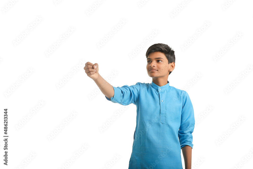 Indian boy in traditional wear and giving hand expression on white background. Indian boy in traditional wear and giving hand expression on white background.