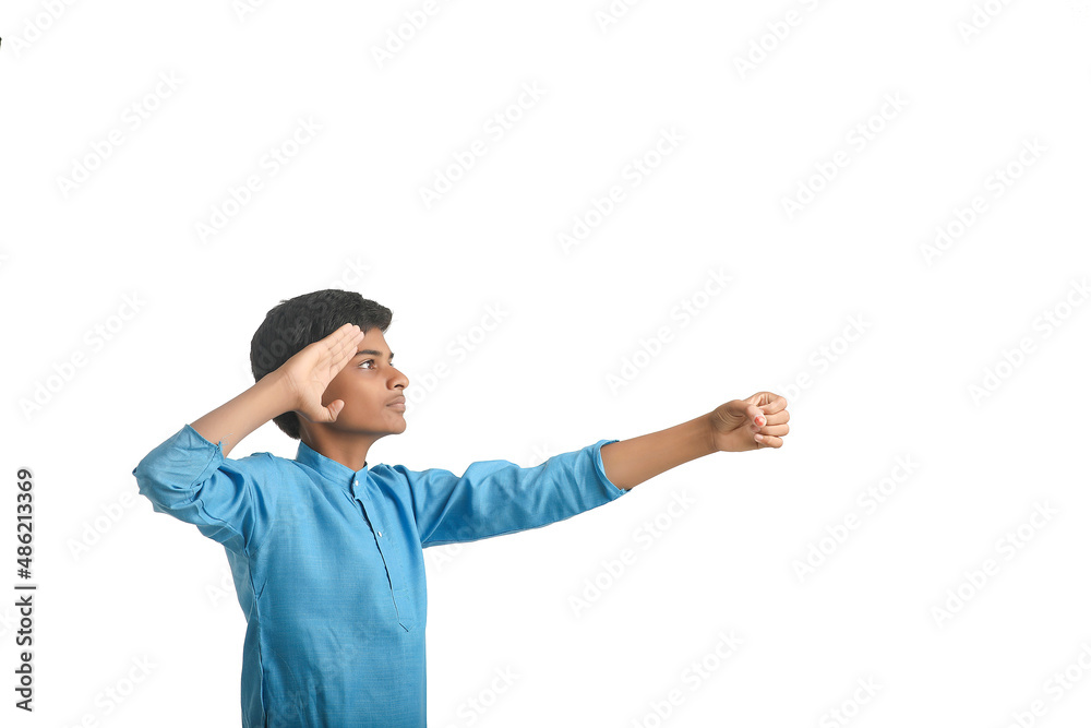 Indian boy in traditional wear and giving hand expression on white background. Indian boy in traditional wear and giving hand expression on white background.