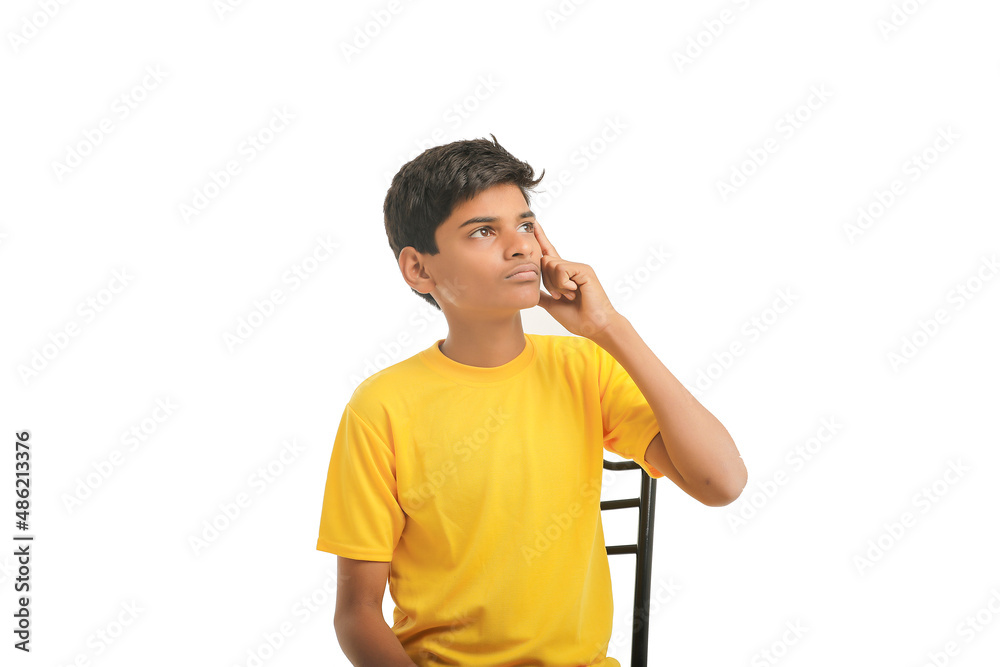 Indian boy thinking some idea on white background. Indian boy thinking some idea on white background.