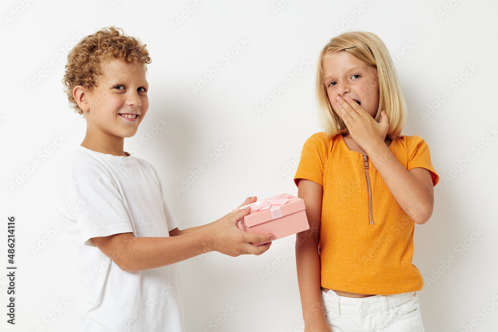 Boy and girl holiday friendship with a gift lifestyle unaltered Boy and girl holiday friendship with a gift lifestyle unaltered