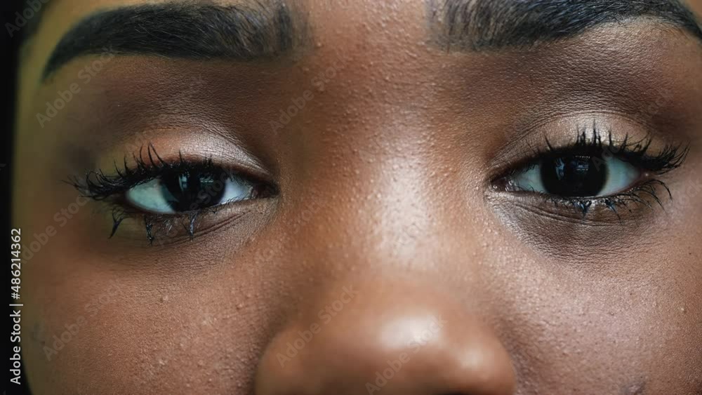 An African young woman macro eyes close-up looking at camera