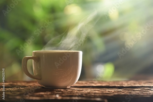 cup of coffee on table in garden