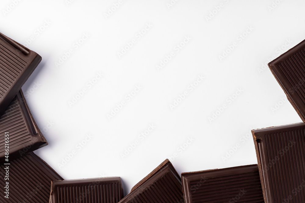 Piece of dark chocolate isolated on white background Piece of dark chocolate isolated on white background