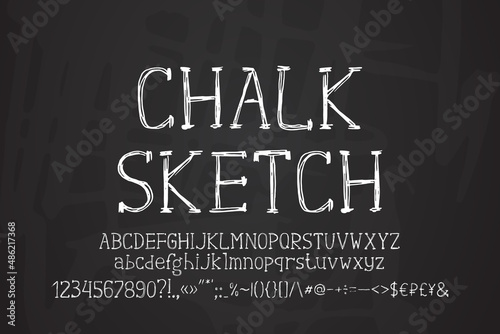 Sketch white serif font on dark blackboard background. Original hand-drawn uppercase and lowercase letters, numbers