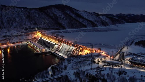 Hydroelectric dam on the river, filming at night with illumination photo