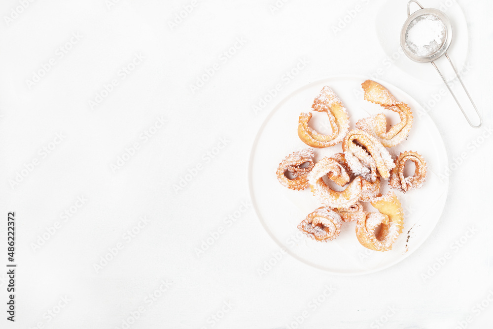 Italian carnival fritters guanto galeno
dusted with polwered sugar served on white plate
. With free text space. Italian carnival fritters guanto galeno
dusted with polwered sugar served on white plate
. With free text space.