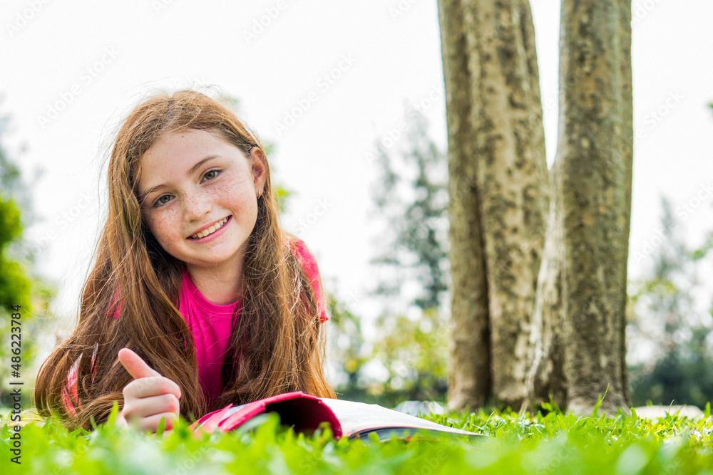 child girl smile read book relax in weekend holiday lifestyle park outdoor child girl smile read book relax in weekend holiday lifestyle park outdoor