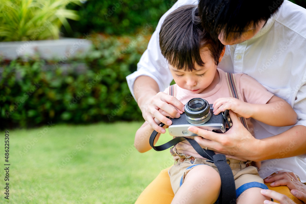 little boy taking photo with mom and dad, happy family. little boy taking photo with mom and dad, happy family.