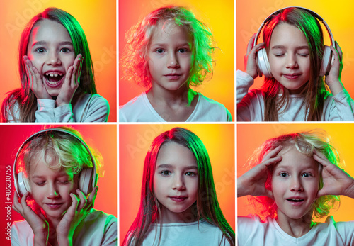 Set of portraits of little cute emotional kids, boy and girl isolated on multicolored studio background in neon light. Education, emotions, facial expression and childhood © master1305