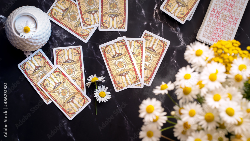 Woman forecasting with Tarot cards, Fortune telling esoteric tarot predictions