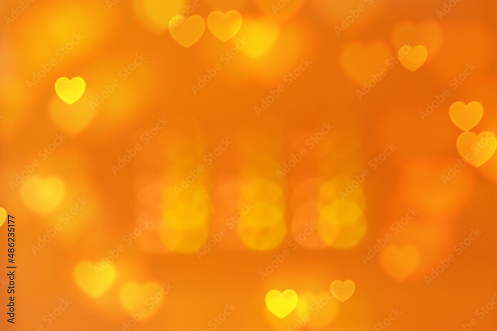 Fototapeta premium Abstract bokeh blur heart shaped yellow background