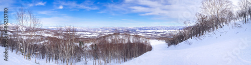Panoramic view of peaks seen from a slope (Niseko, Hokkaido, Japan) photo
