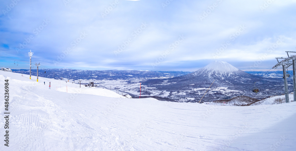Slope with snowy volcano in a ski resort (Niseko, Hokkaido, Japan) Slope with snowy volcano in a ski resort (Niseko, Hokkaido, Japan)