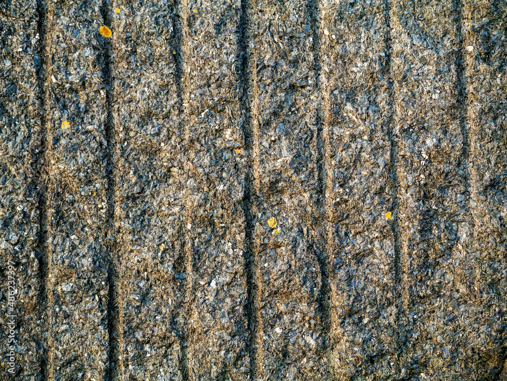 Obraz premium Granite stone surface with cut out marks. Abstract background for design