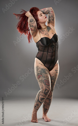 Glamour plus size model with tattoos photo