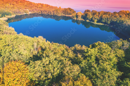 Picturesque mountain lake in autumn. Lake against the sea. Aerial view