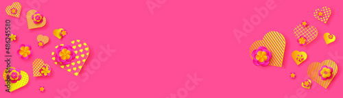 Festive background. Golden hearts and pink flowers